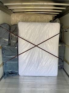 Large items secured in the back of a moving truck